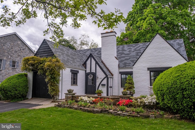 439 W Park Ave, State College, PA 16803 - view of front of property featuring a high end roof, a chimney, and a front yard