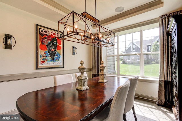 dining area featuring a chandelier, plenty of natural light, and baseboards
