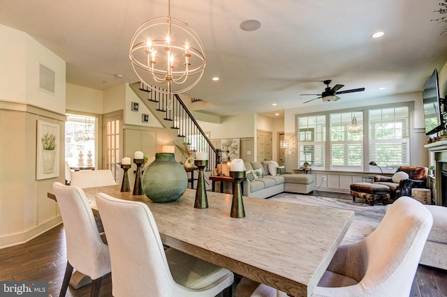 dining space featuring a chandelier, healthy amount of natural light, a ceiling fan, dark wood-style flooring, and recessed lighting