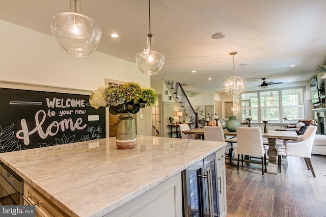 kitchen featuring wine cooler, dark wood-style flooring, a ceiling fan, decorative light fixtures, and recessed lighting