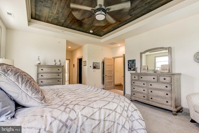 bedroom featuring a tray ceiling, carpet, wood ceiling, recessed lighting, and connected bathroom