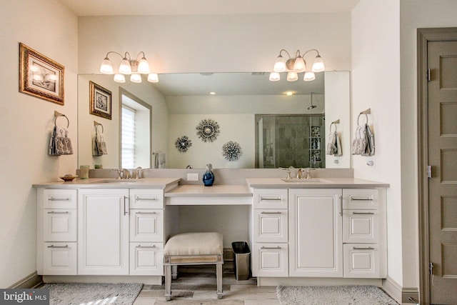 bathroom with a walk in shower, vanity, and wood finished floors