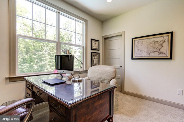 office with light colored carpet, healthy amount of natural light, and baseboards