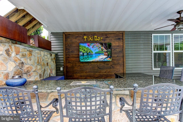 view of patio / terrace with a ceiling fan and outdoor dining area