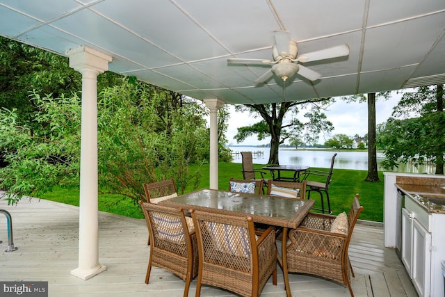 8320 Ingleton Cir W, Easton, MD 21601 - deck featuring ceiling fan, outdoor dining area, a water view, and a yard