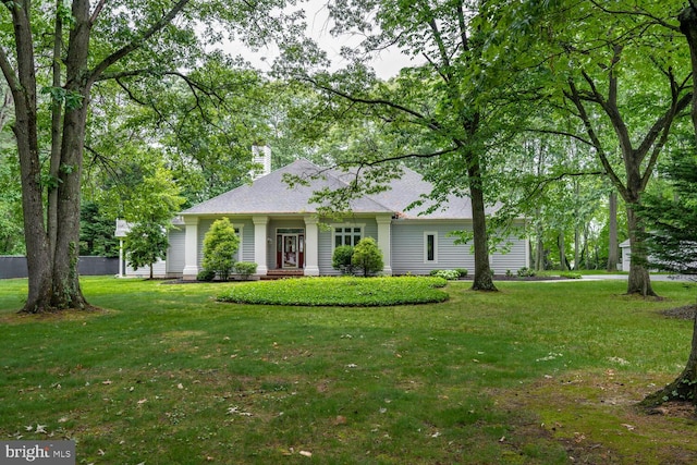 8320 Ingleton Cir W, Easton, MD 21601 - view of front of property featuring a front lawn, a chimney, and roof with shingles