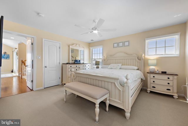 127 E 13th St, Long Beach Township, NJ 08008 - bedroom with light carpet, baseboards, and a ceiling fan