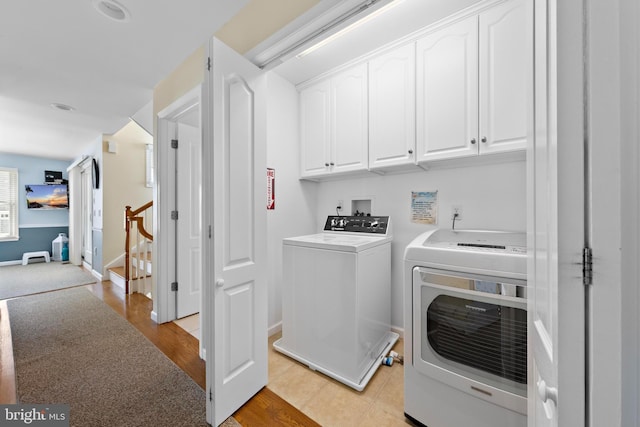 127 E 13th St, Long Beach Township, NJ 08008 - washroom featuring cabinet space, washer and dryer, light wood-style floors, and baseboards