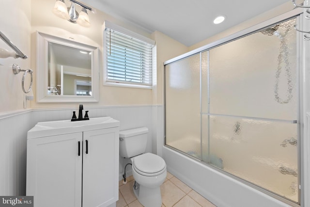 127 E 13th St, Long Beach Township, NJ 08008 - full bathroom with a wainscoted wall, toilet, enclosed tub / shower combo, vanity, and tile patterned flooring