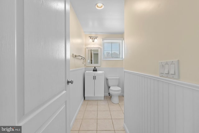 127 E 13th St, Long Beach Township, NJ 08008 - half bath featuring toilet, tile patterned flooring, wainscoting, and vanity