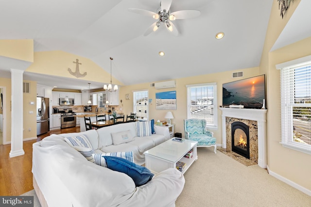 127 E 13th St, Long Beach Township, NJ 08008 - living area featuring lofted ceiling, ceiling fan, healthy amount of natural light, baseboards, and a premium fireplace