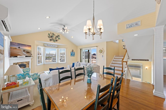 127 E 13th St, Long Beach Township, NJ 08008 - dining room with ceiling fan, stairway, lofted ceiling, a fireplace, and a wall unit AC