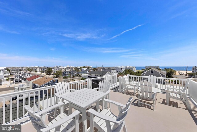 127 E 13th St, Long Beach Township, NJ 08008 - wooden terrace featuring outdoor dining area and a water view