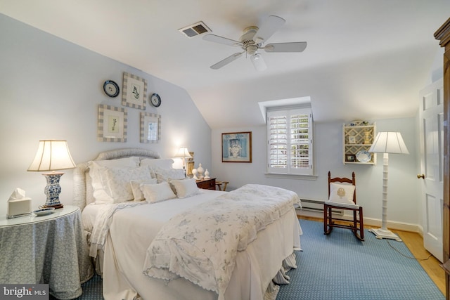 bedroom featuring wood finished floors, baseboards, ceiling fan, and lofted ceiling