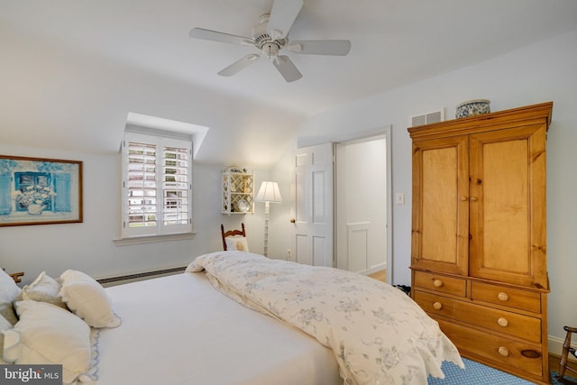 bedroom with baseboard heating, a ceiling fan, and vaulted ceiling