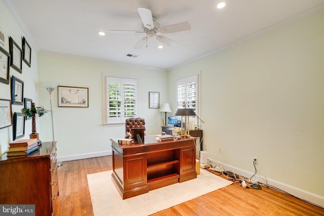 office space featuring light wood finished floors, ornamental molding, ceiling fan, recessed lighting, and baseboards