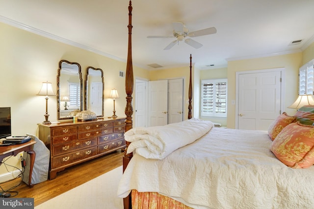 bedroom featuring wood finished floors, ornamental molding, and a ceiling fan