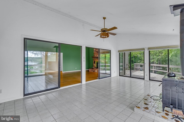 109 Kingfisher Cir, Weems, VA 22576 - unfurnished living room featuring ceiling fan, tile patterned flooring, and high vaulted ceiling