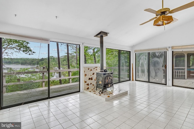109 Kingfisher Cir, Weems, VA 22576 - sunroom / solarium featuring a wood stove, a water view, and lofted ceiling