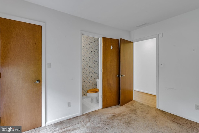 109 Kingfisher Cir, Weems, VA 22576 - unfurnished bedroom with carpet, connected bathroom, and baseboards