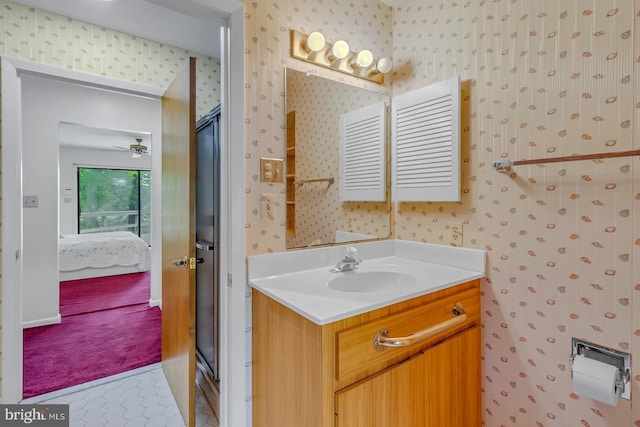 109 Kingfisher Cir, Weems, VA 22576 - ensuite bathroom with wallpapered walls, vanity, and tile patterned flooring