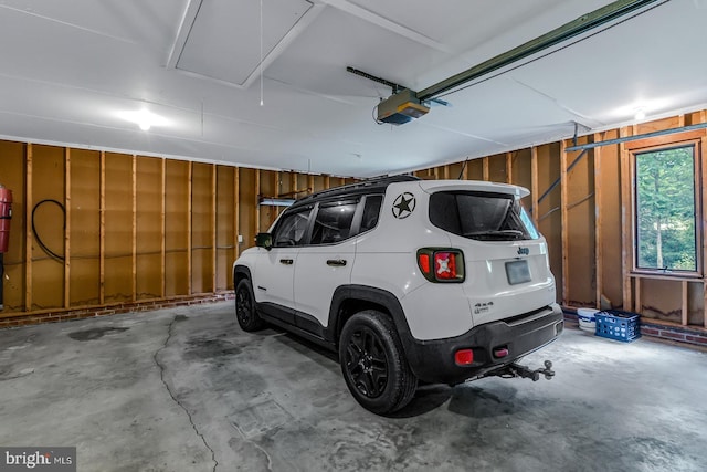 109 Kingfisher Cir, Weems, VA 22576 - garage with a garage door opener and wood walls