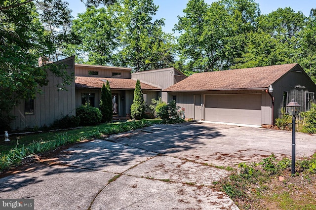109 Kingfisher Cir, Weems, VA 22576 - mid-century home with an attached garage and driveway