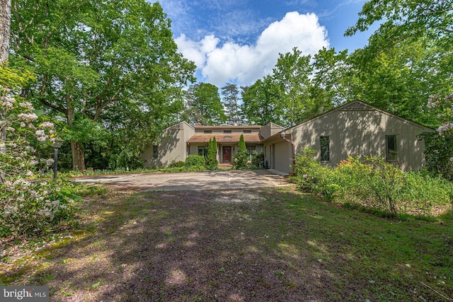 109 Kingfisher Cir, Weems, VA 22576 - view of front of house featuring a garage and driveway