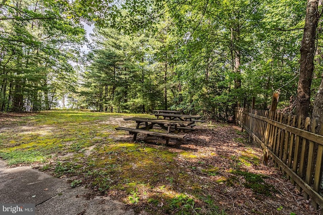 109 Kingfisher Cir, Weems, VA 22576 - view of yard with fence and a view of trees