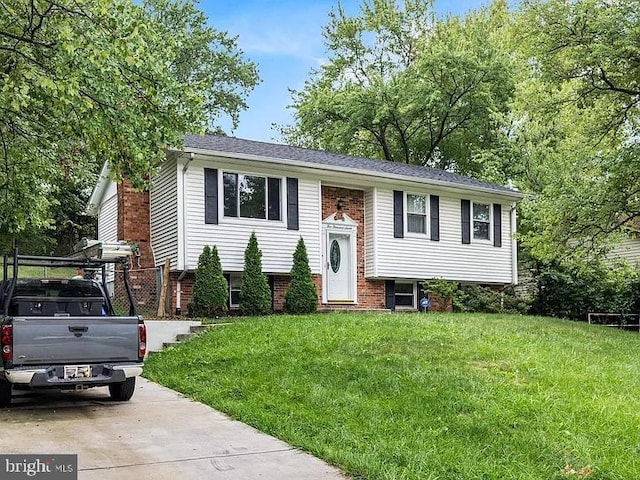 bi-level home with a front yard