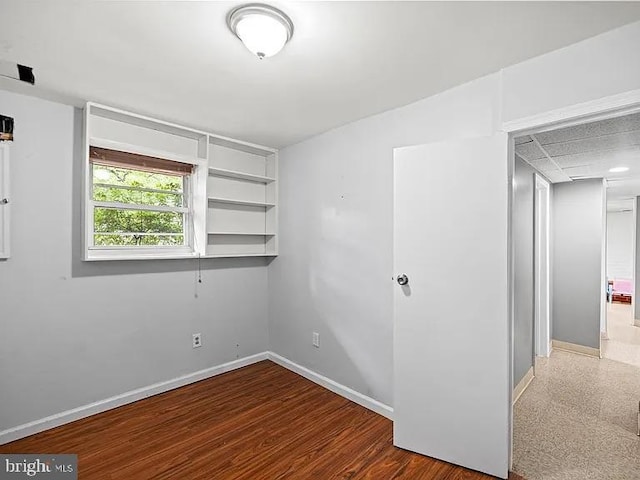 unfurnished room featuring baseboards