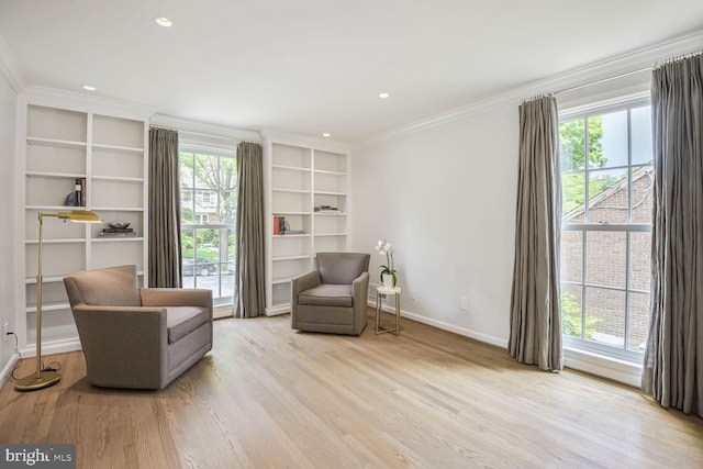 4701 Fort Sumner Dr, Bethesda, MD 20816 - sitting room with ornamental molding, wood finished floors, baseboards, recessed lighting, and built in features
