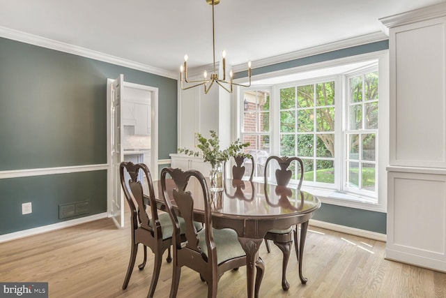 4701 Fort Sumner Dr, Bethesda, MD 20816 - dining room featuring a chandelier, baseboards, light wood-style floors, and ornamental molding
