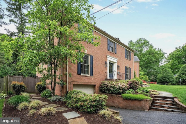 4701 Fort Sumner Dr, Bethesda, MD 20816 - colonial-style house with a garage and brick siding