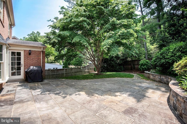 4701 Fort Sumner Dr, Bethesda, MD 20816 - fenced backyard with grilling area and a patio