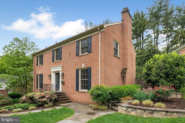 4701 Fort Sumner Dr, Bethesda, MD 20816 - colonial-style house featuring a chimney and brick siding