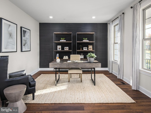 office area with an accent wall, baseboards, recessed lighting, and dark wood finished floors