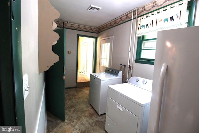 washroom featuring independent washer and dryer