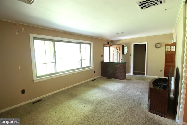 unfurnished bedroom with carpet floors and baseboards