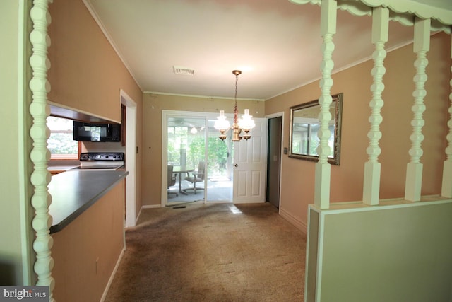 hallway featuring carpet floors, a chandelier, baseboards, and crown molding