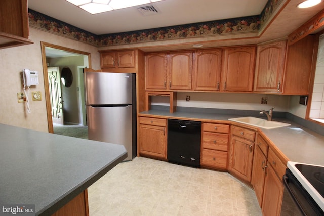 kitchen with dishwasher, freestanding refrigerator, a sink, electric range oven, and brown cabinets