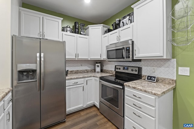 1731 Webland Park, Charlottesville, VA 22901 - kitchen with appliances with stainless steel finishes, white cabinetry, and dark wood-style flooring