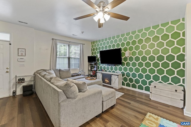 1731 Webland Park, Charlottesville, VA 22901 - living room with an accent wall, ceiling fan, wood finished floors, and a warm lit fireplace
