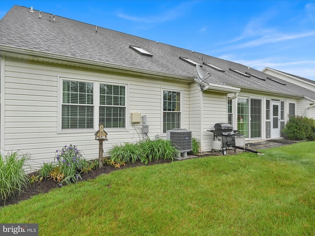 7705 Forney Way, Harrisburg, PA 17112 - back of house featuring central AC unit, a yard, and a shingled roof