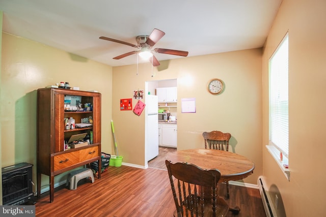 415 Garnet Dr, Burlington, NJ 08016 - dining area with wood finished floors, ceiling fan, baseboards, and a baseboard radiator