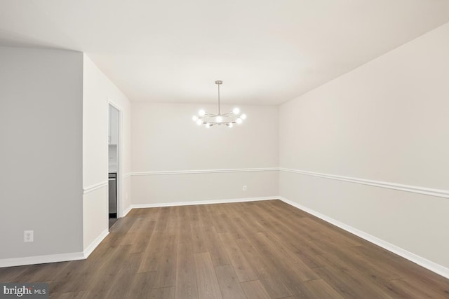 1900 Lyttonsville Rd Unit 216, Silver Spring, MD 20910 - empty room featuring a chandelier, dark wood finished floors, and baseboards