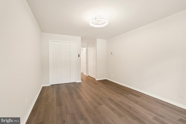 1900 Lyttonsville Rd Unit 216, Silver Spring, MD 20910 - unfurnished room featuring baseboards and dark wood-style flooring