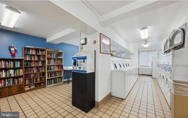 1900 Lyttonsville Rd Unit 216, Silver Spring, MD 20910 - shared laundry room featuring stacked washer / drying machine, tile patterned flooring, and washer and dryer