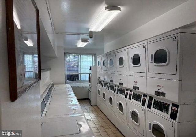 1900 Lyttonsville Rd Unit 216, Silver Spring, MD 20910 - communal laundry room featuring stacked washer / drying machine, washing machine and dryer, and mail area