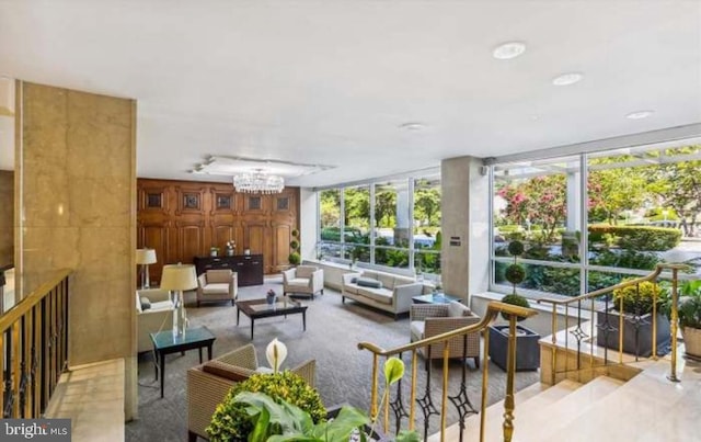 1900 Lyttonsville Rd Unit 216, Silver Spring, MD 20910 - living area featuring healthy amount of natural light and a chandelier